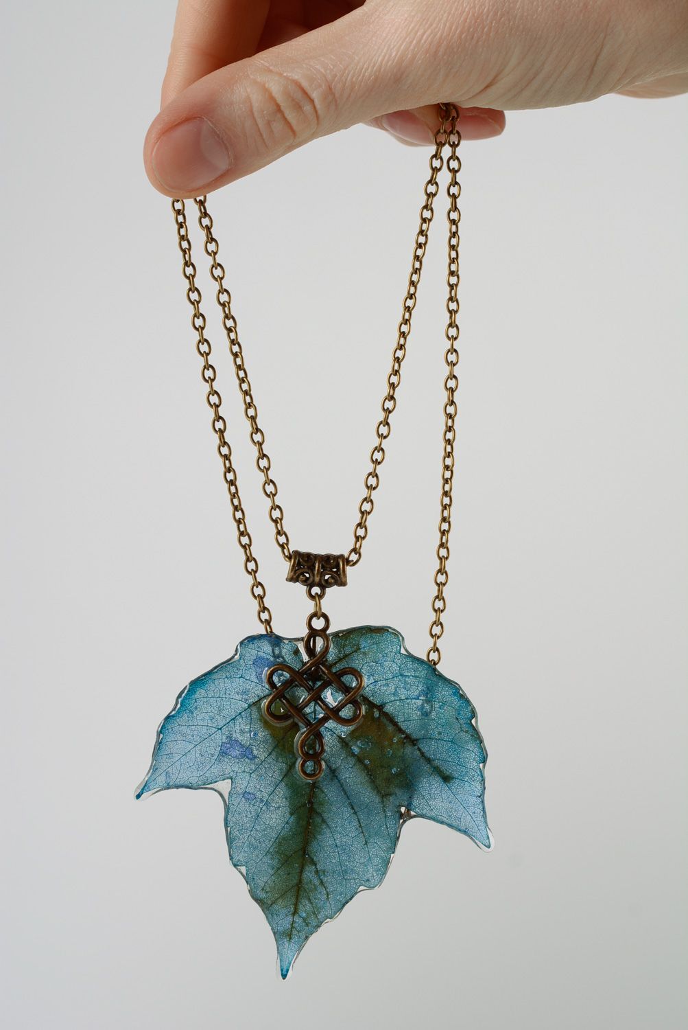 Handmade pendant with maple leave coated with epoxy and equipped with long chain photo 2