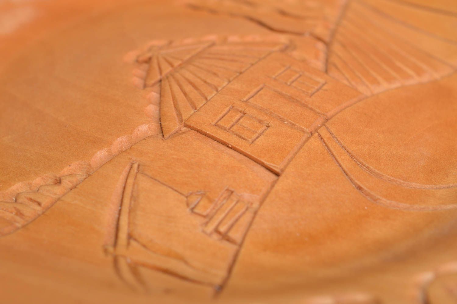 Handmade cute beautiful plate made of wood with carving in ethnic style photo 4