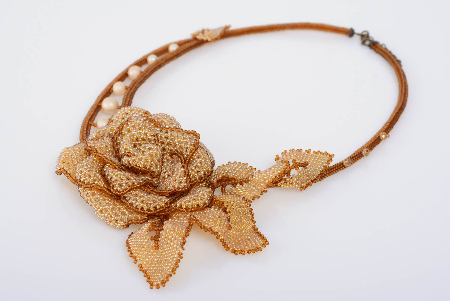 Unusual handmade woven beige beaded necklace with flower photo 1