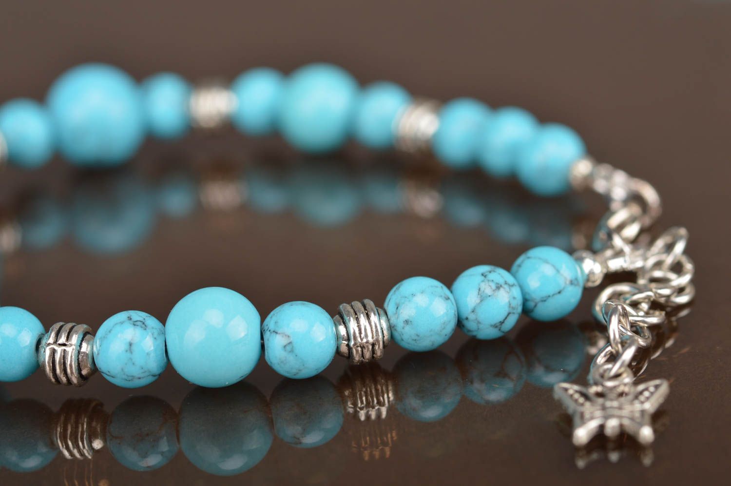 Blue handmade bracelet made of beads of turquoise color with separators photo 5