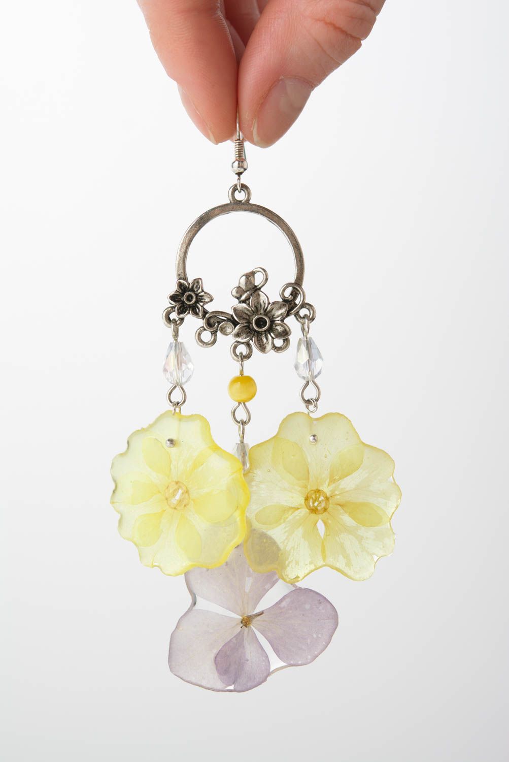 Handmade decorative earrings with primrose and hydrangea petals in epoxy resin photo 4