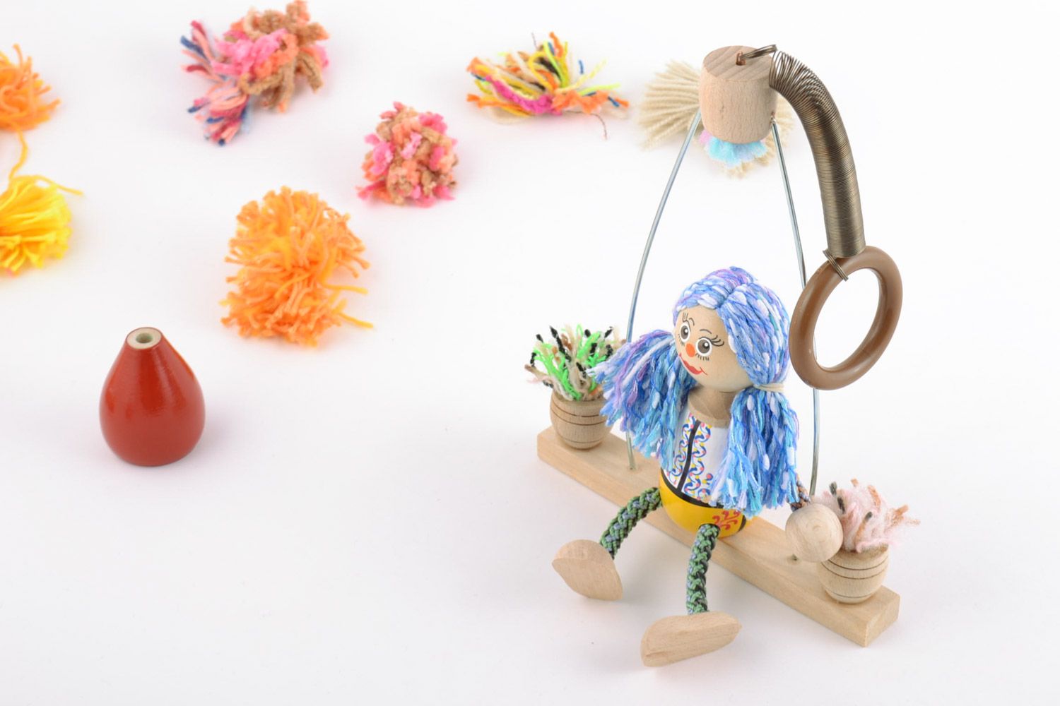 Handmade decorative beautiful wooden eco doll on the bench with hand-painting photo 1