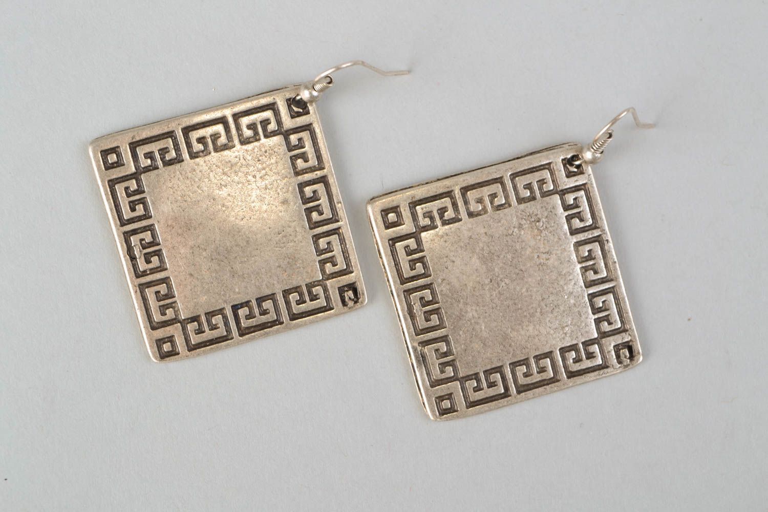 Metal earrings in the shape of rhombus photo 3