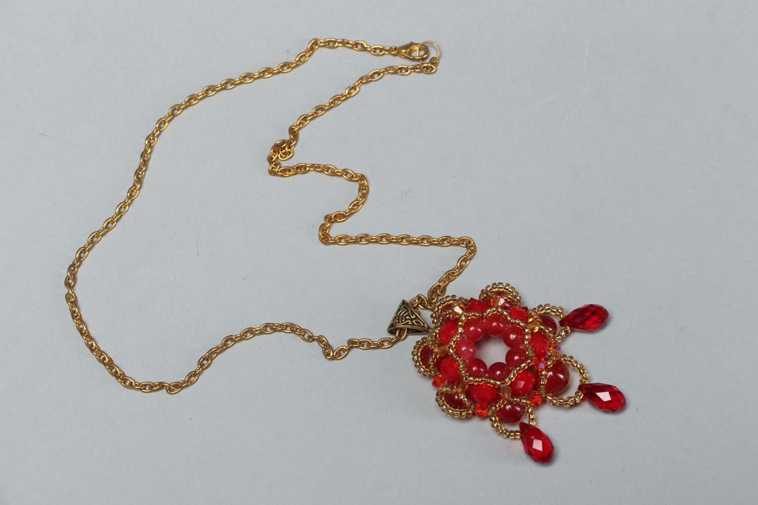 Handmade beaded pendant with natural stones photo 1