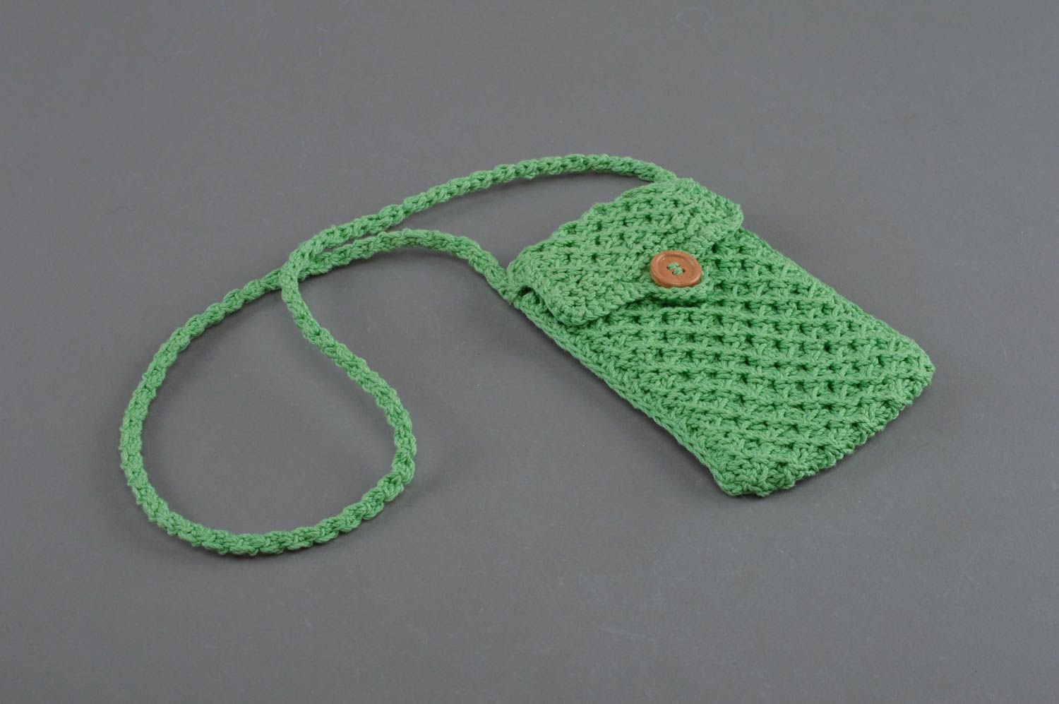 Beautiful handmade small crochet phone case of green color with long strap photo 1