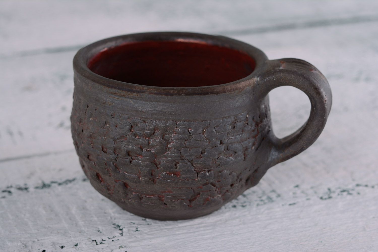 Taza original decorada de cerámica hecha a mano sin asa de tostación reductora foto 1