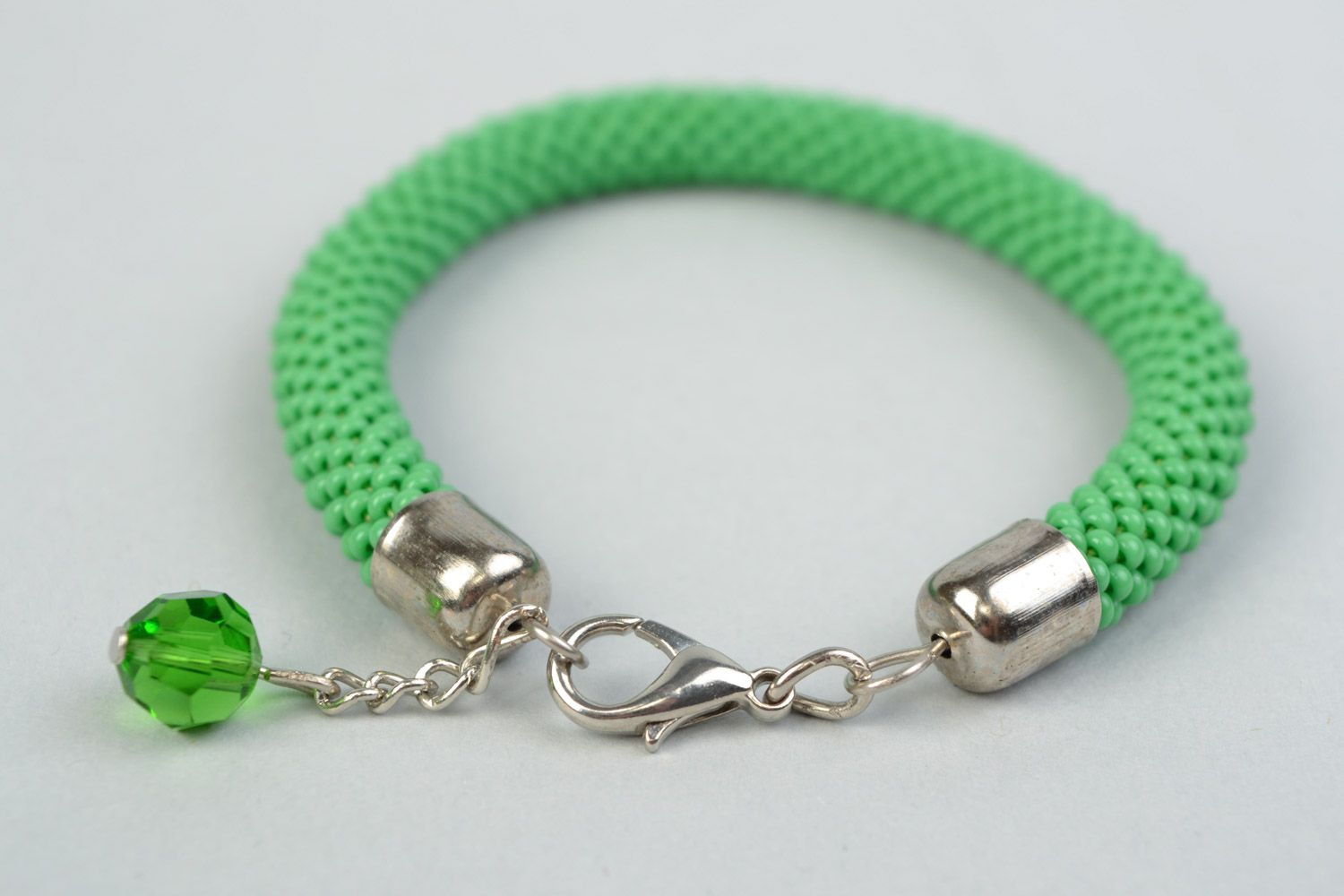 Beautiful handmade tender green beaded cord women's wrist bracelet with charm photo 4