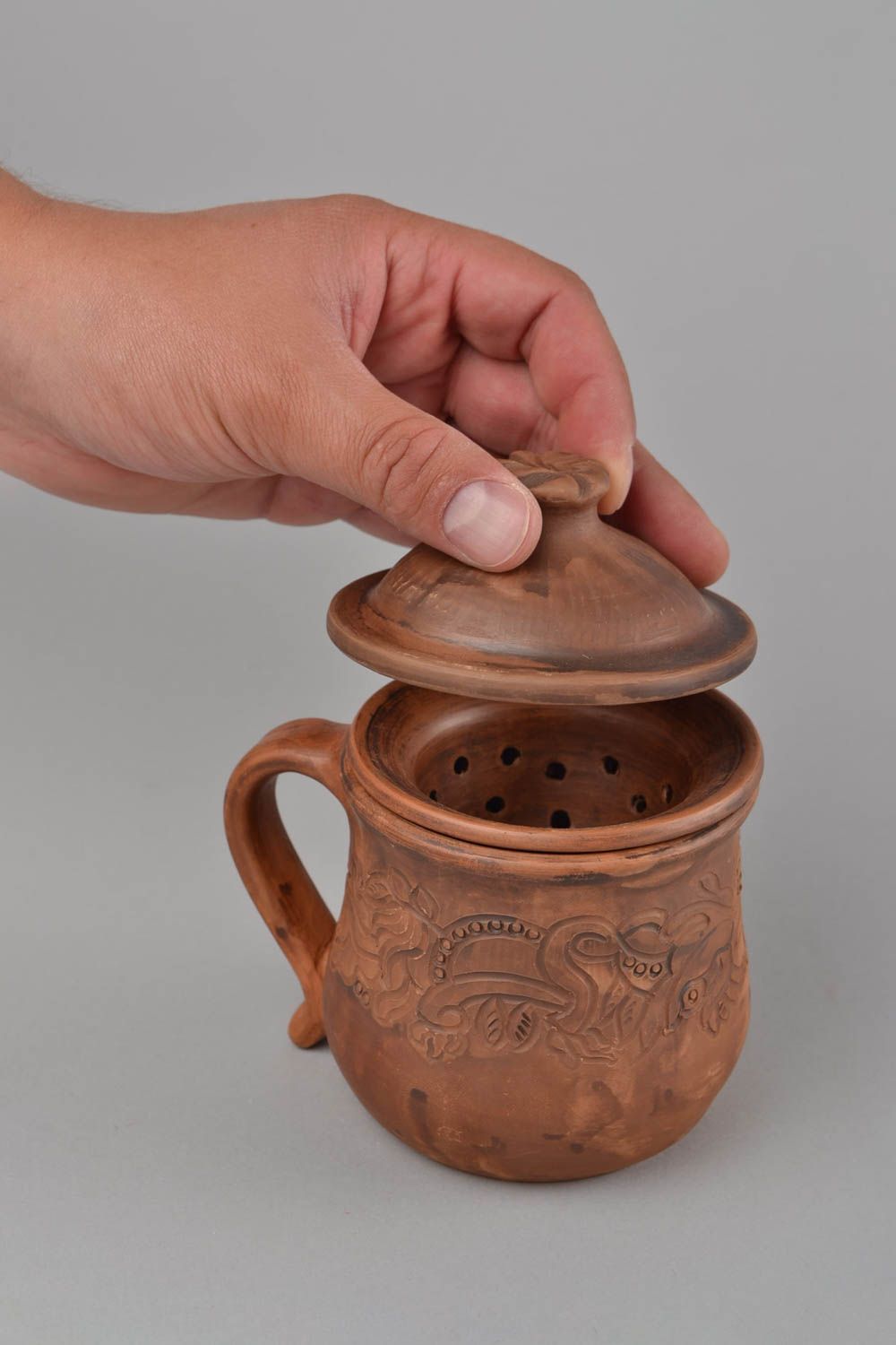Molded clay cup for tea making with Mayan patterns and lid in brown color photo 2