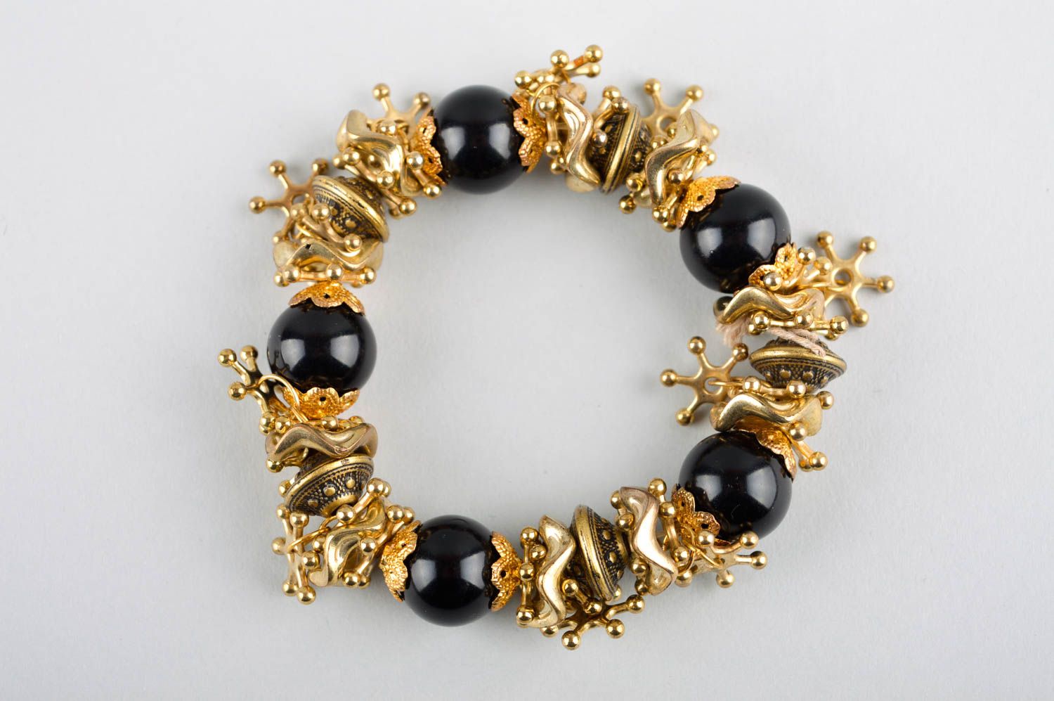 Elastic stretchy bracelet with black beads and golden color charms for teen girl photo 2