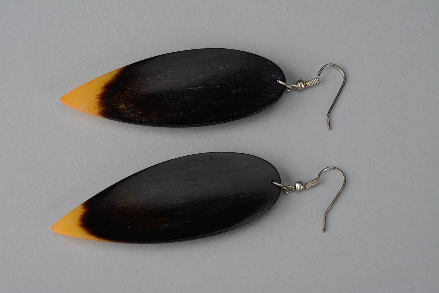 Cow horn earrings of yellow and black color Arrow photo 2