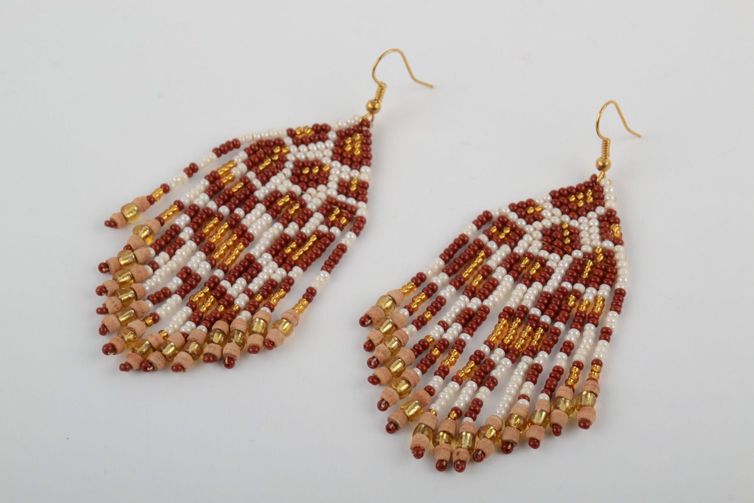 Handmade long dangle earrings woven of beads and thread of white and brown colors photo 3