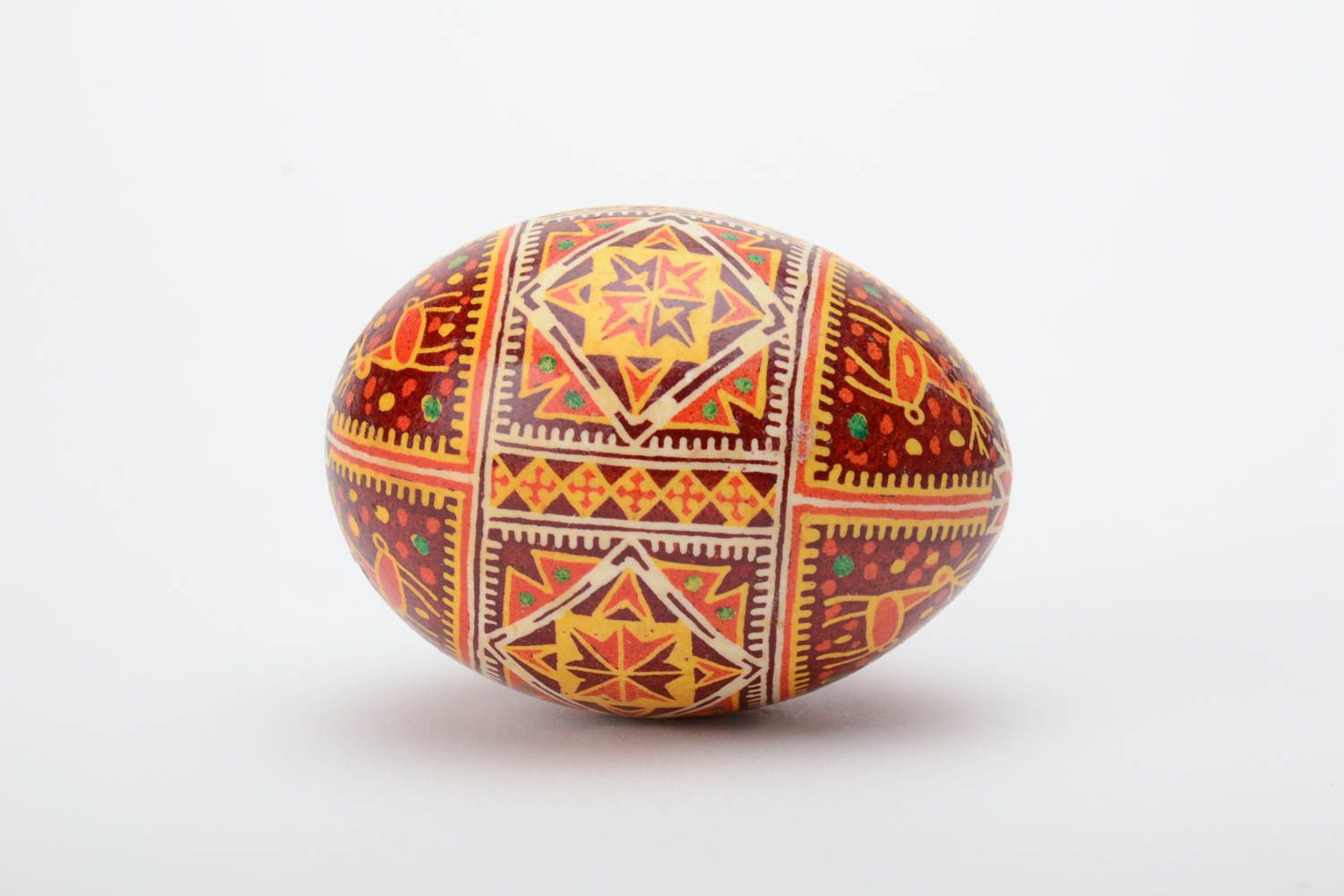 Homemade decorative souvenir Easter egg painted with hot wax and aniline dyes photo 3