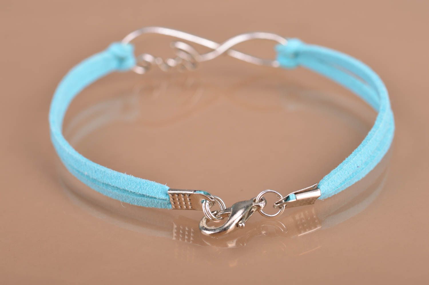 Handmade laconic thin blue suede cord wrist bracelet with metal insert infinity  photo 5