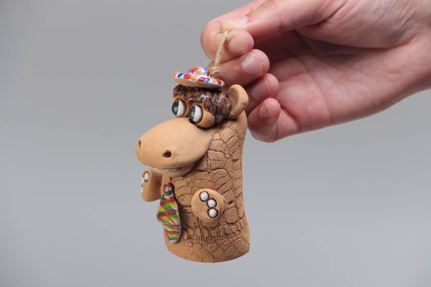 Handmade designer decorative small hanging ceramic bell in the shape of hippo photo 5