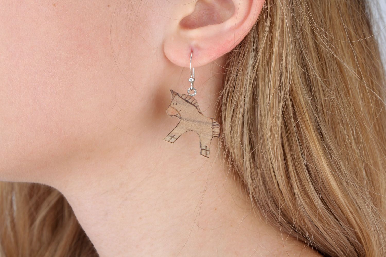 Wooden earrings in the shape of horses photo 1