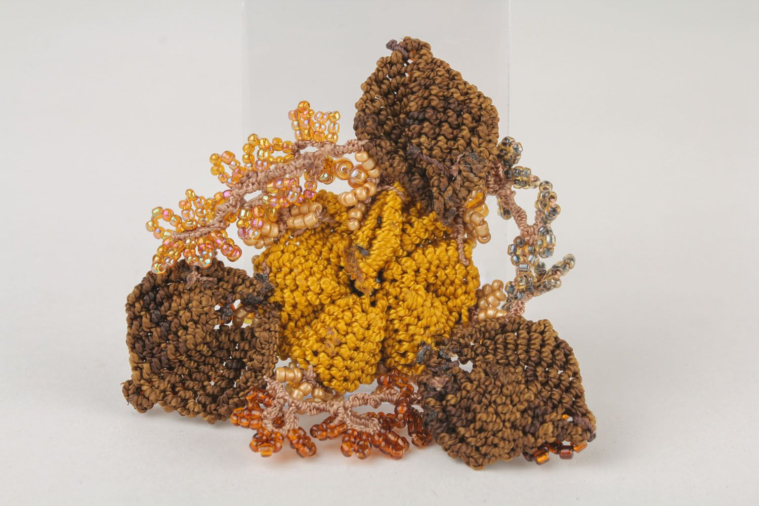 Beautiful brooch made of threads and beads photo 3