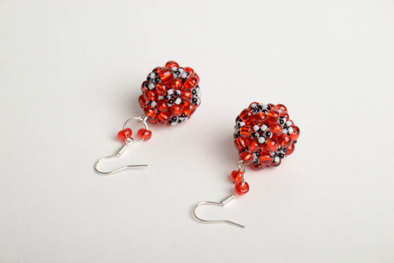 Handmade designer ball shaped dangling earrings crocheted of red Czech beads photo 2