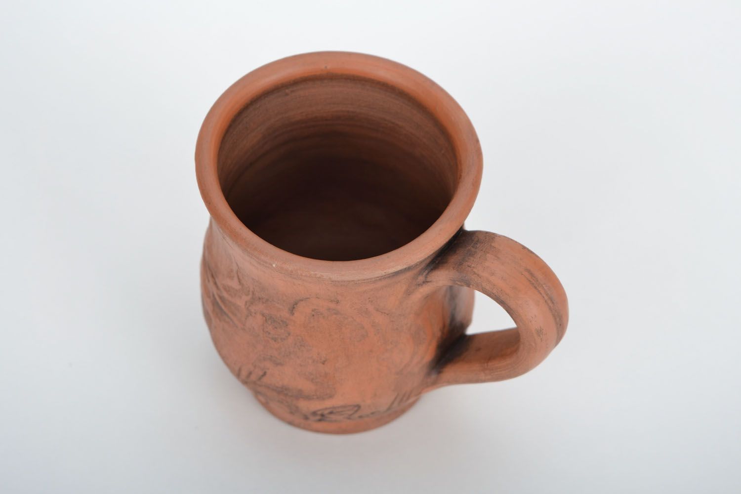 Red clay drinking cup with rustic floral pattern photo 5
