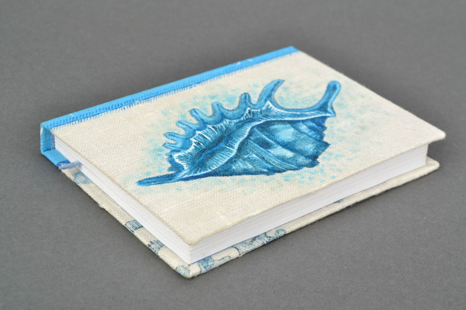 Notebook with sea shell photo 1