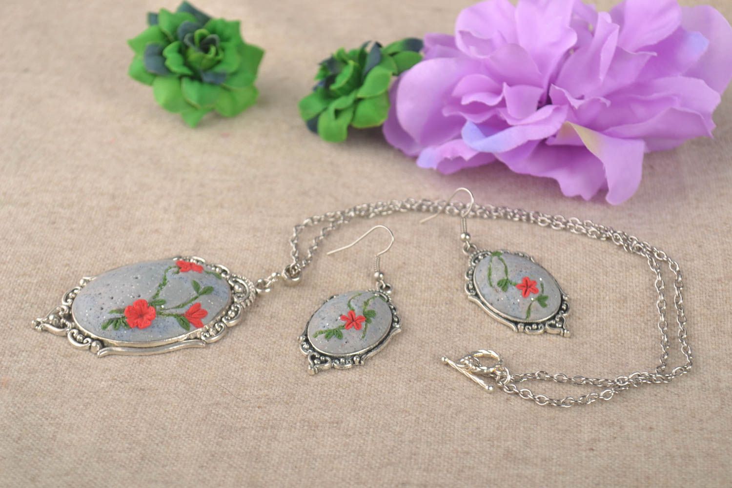 Designer handmade jewelry earrings and a necklace made of polymer clay present photo 1