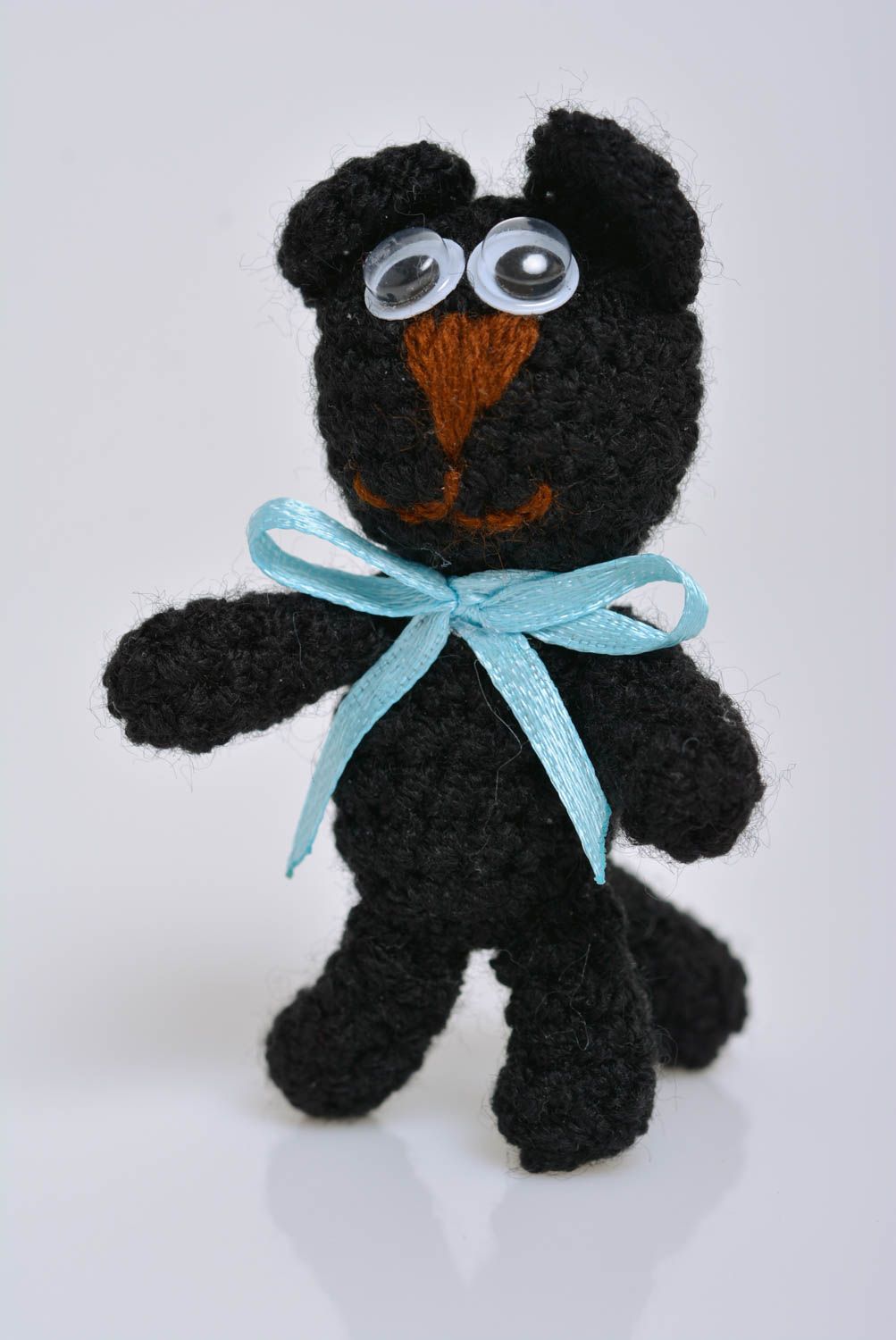 Small black children's handmade soft toy kitty crocheted of acrylic threads photo 1