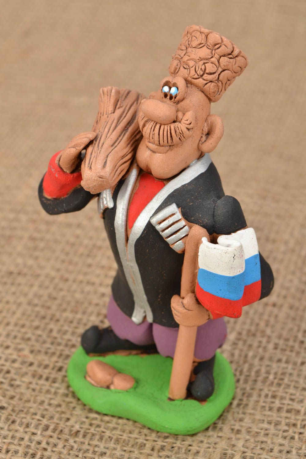 Deko Figur aus Ton Kosak mit Knüppel  foto 1