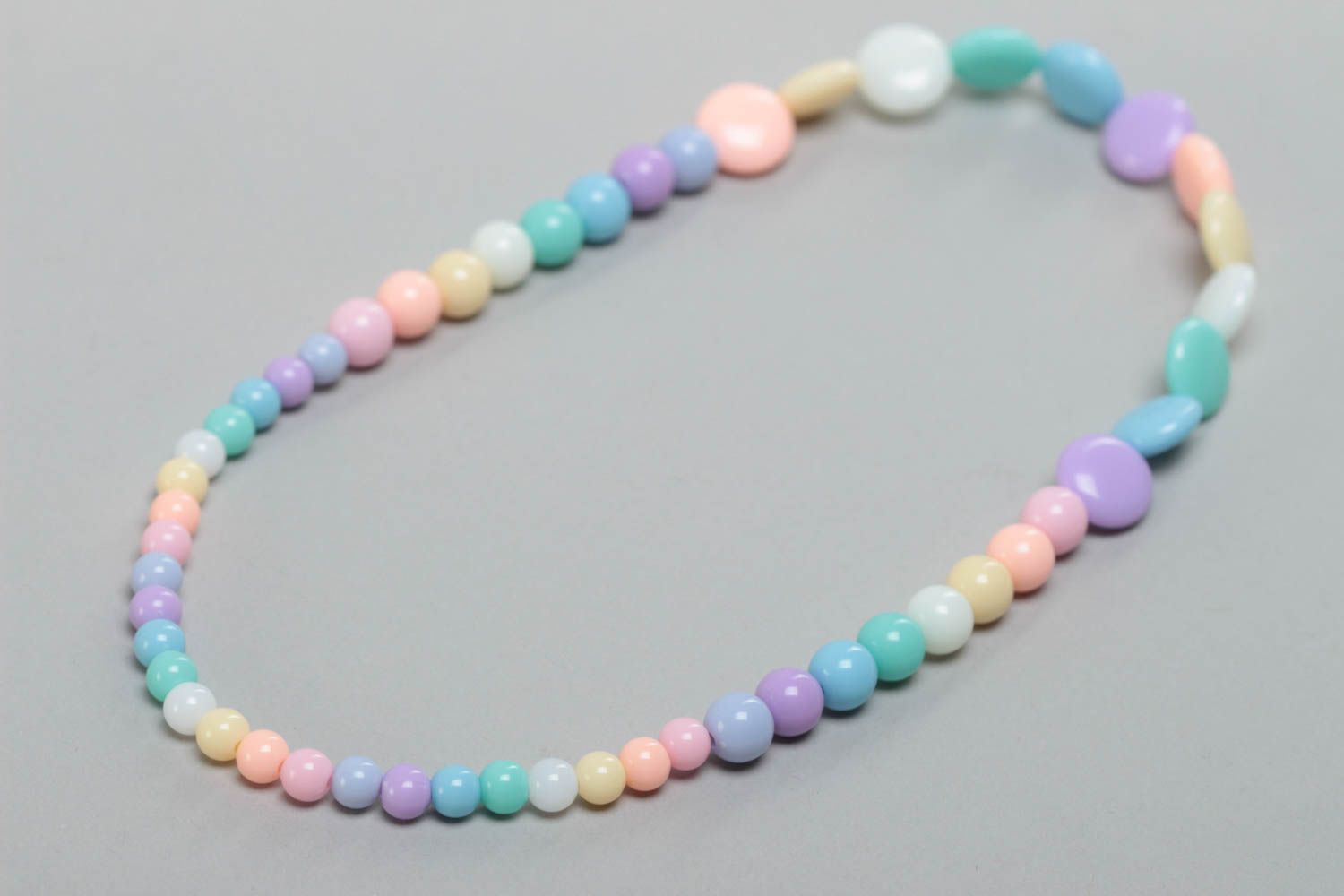 Handmade designer long children's plastic bead necklace of pastel colors photo 4