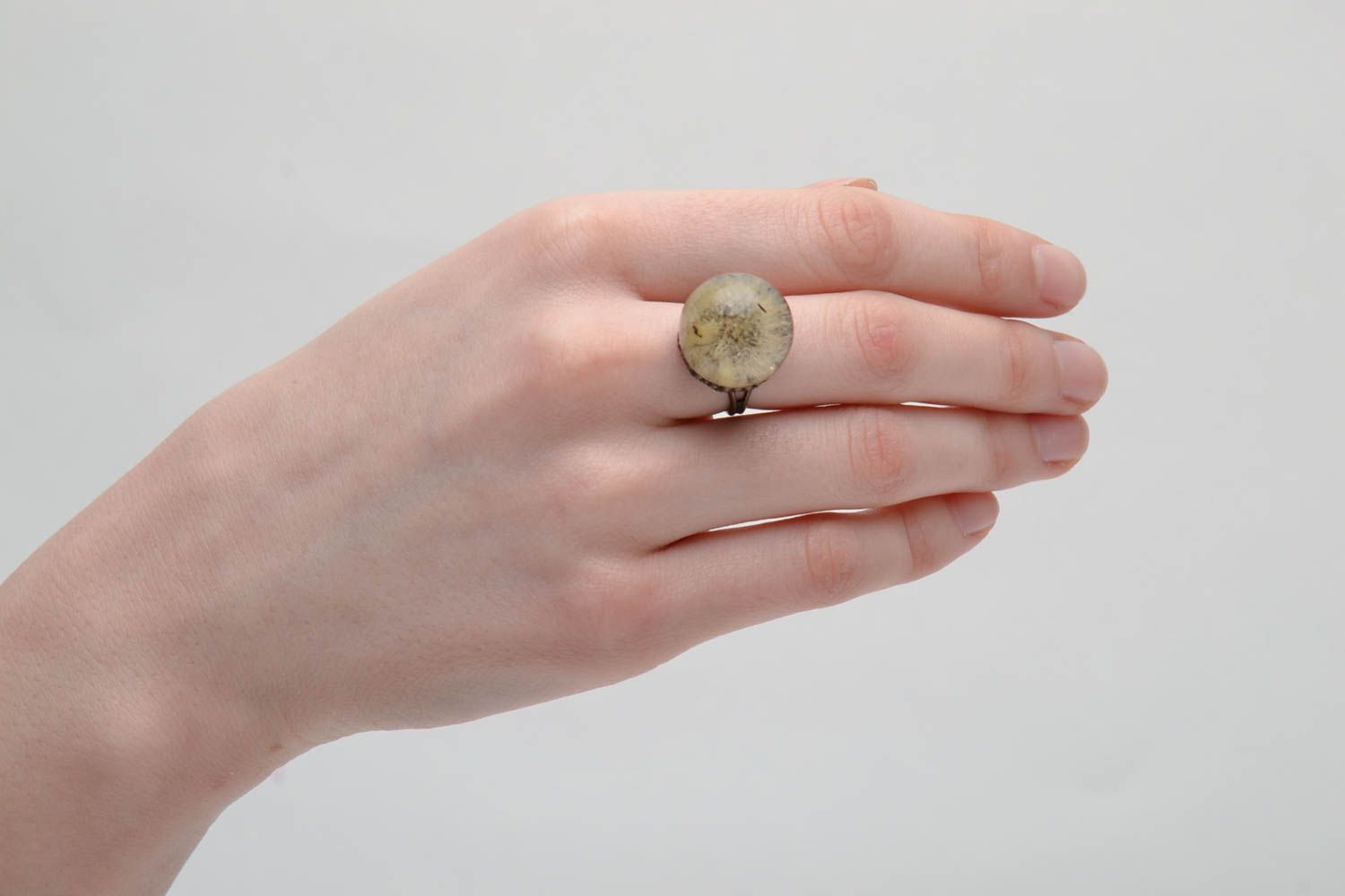 Bronze ring with natural dandelion in epoxy resin photo 2