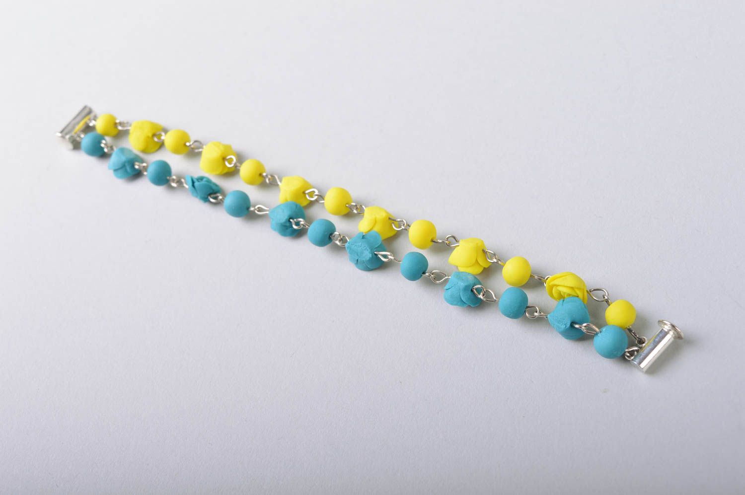 Handmade bright wrist bracelet with blue and yellow cold porcelain rose flowers photo 5