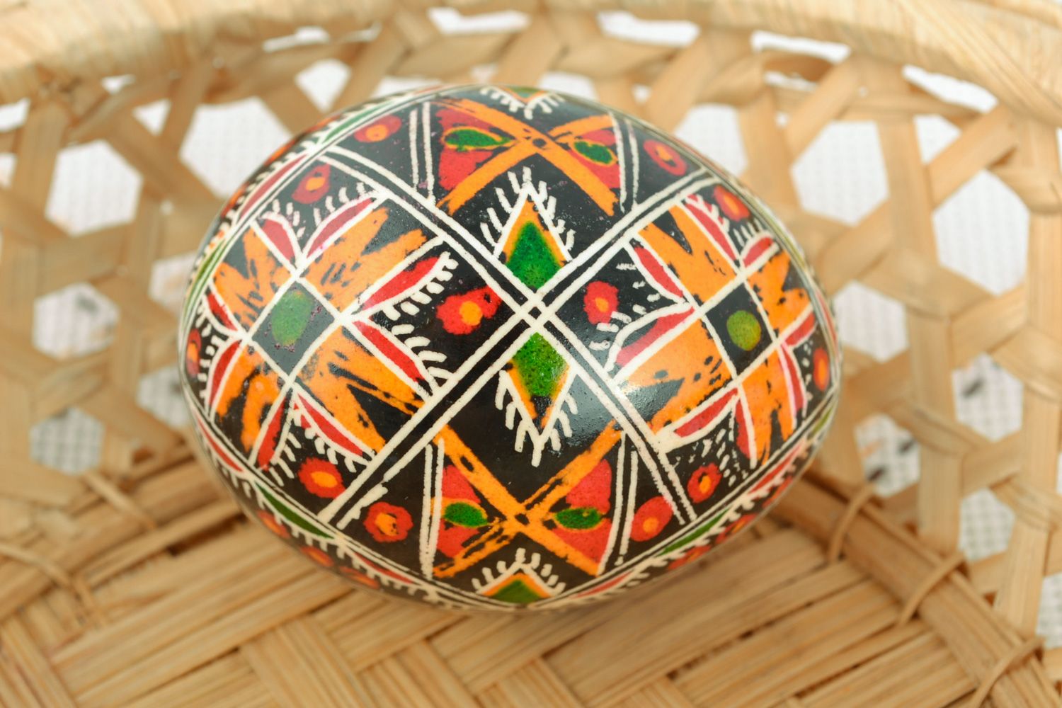 Beautiful handmade chicken egg painted with geometric ornament using wax technique  photo 1