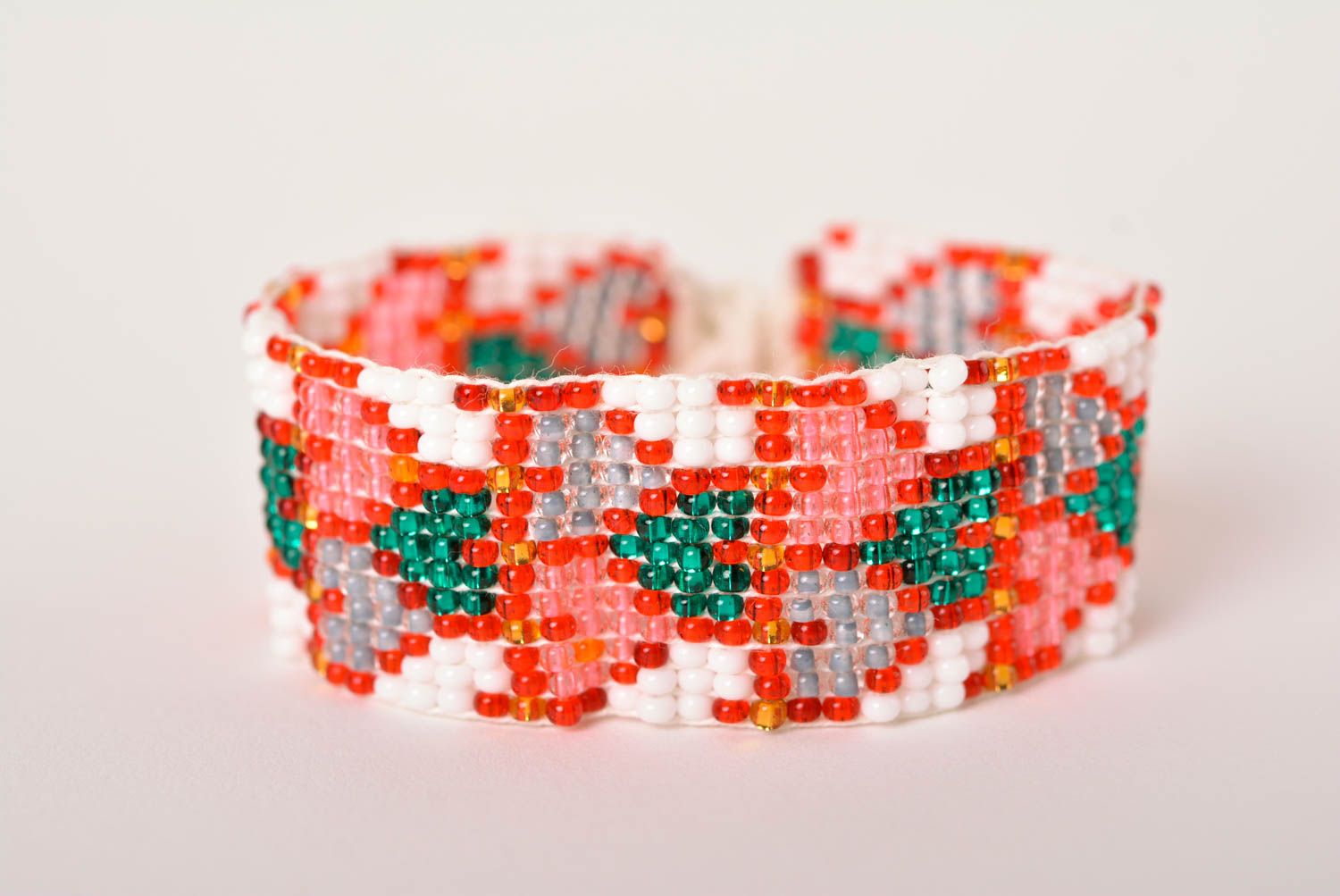 Wide handmade red and green beads bracelet in white on the white cord and ethnic style photo 1