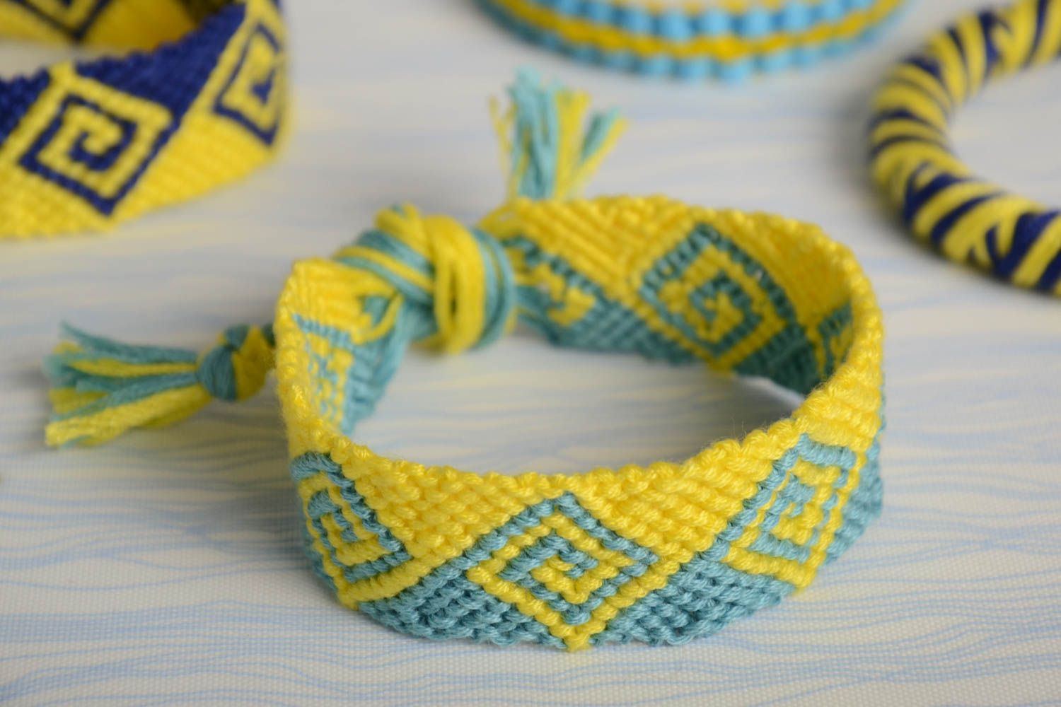 Yellow and blue handmade wide woven embroidery floss bracelet with ties photo 1