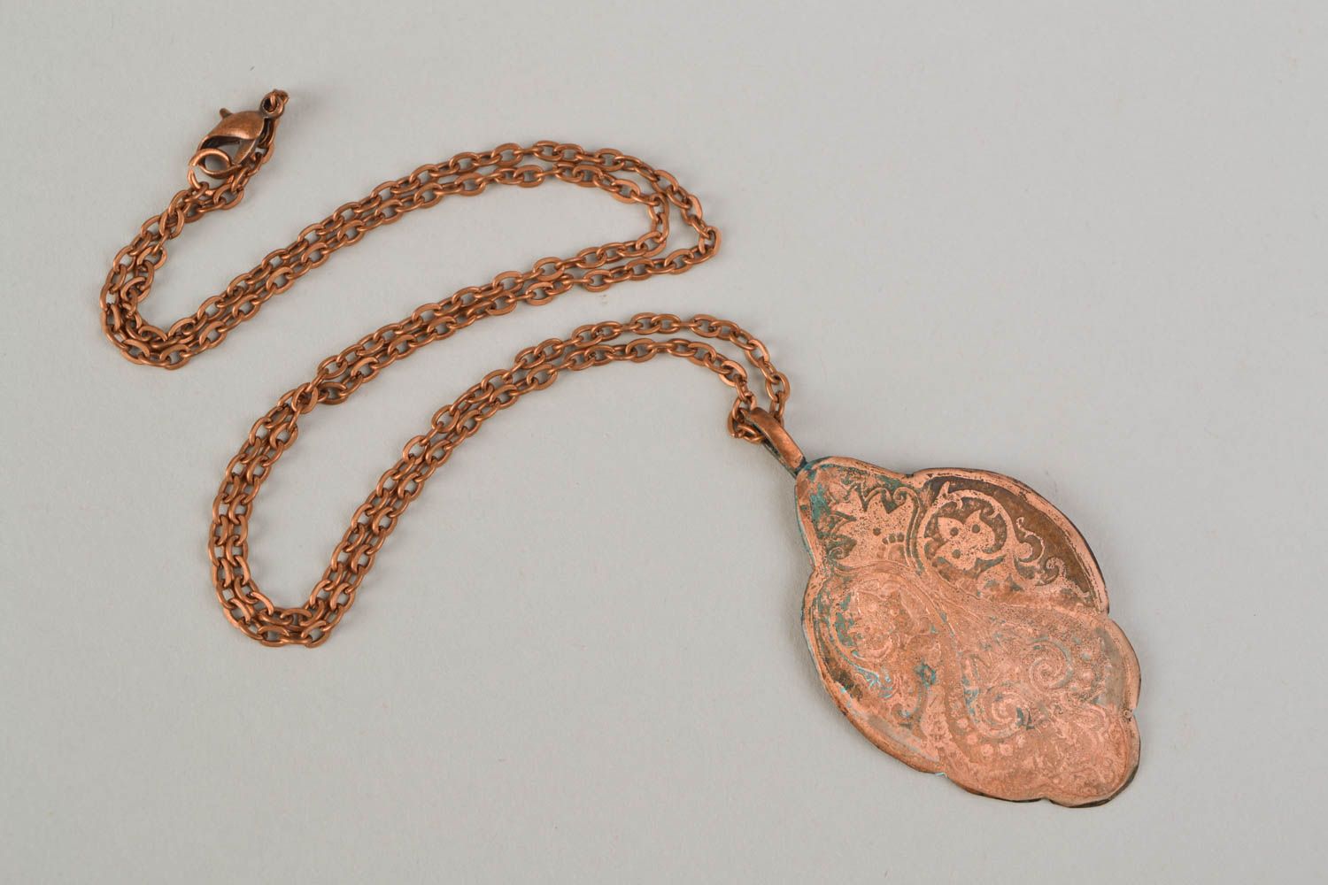 Copper pendant on long chain created using patina coating and etching techniques photo 5