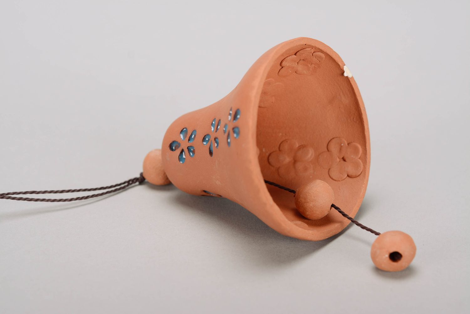Bell made from red clay photo 1