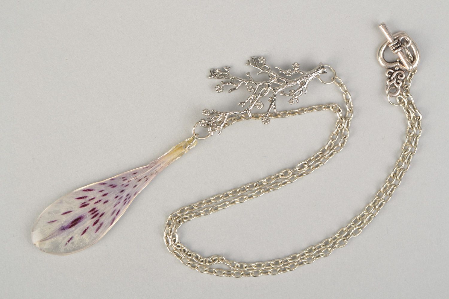 Elegant handmade pendant with alstroemeria petal in epoxy resin on metal chain photo 3