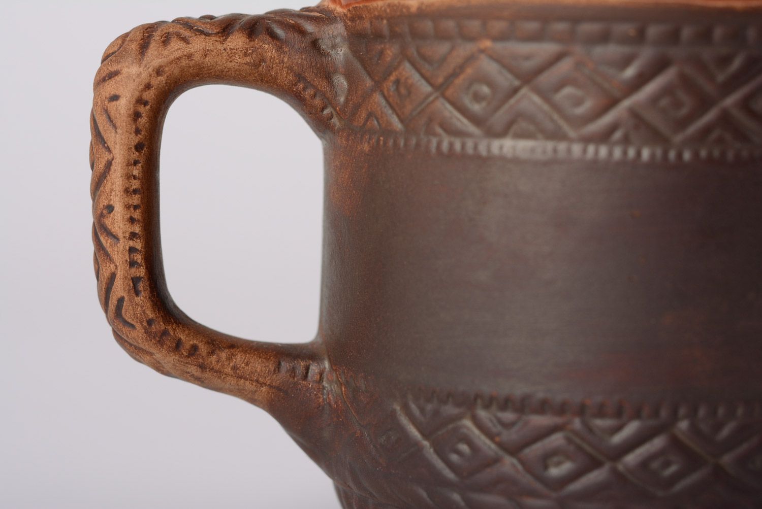 Rustic clay glazed cup with geometrical patterns and handle photo 3