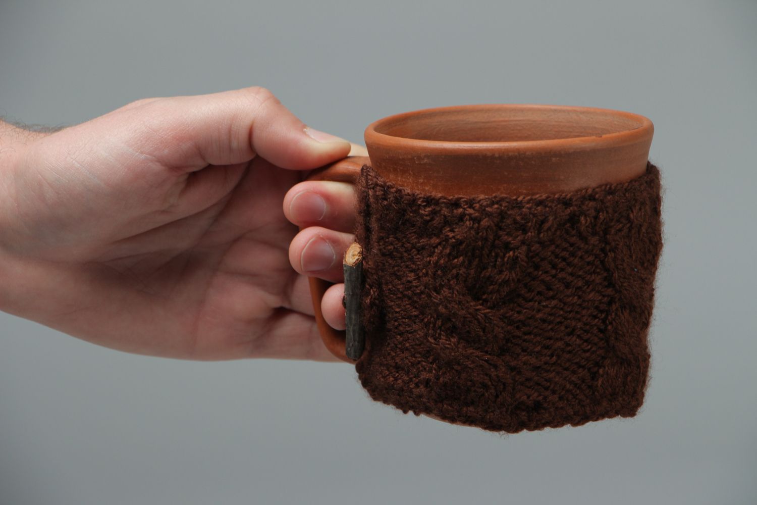 Ceramic cup in terracotta color with knitted back cozy cover photo 4