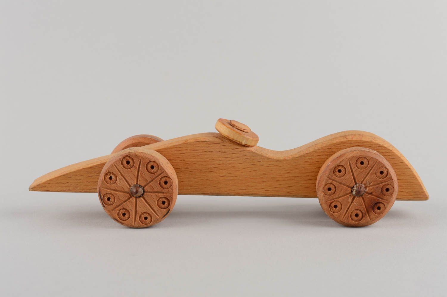 Handmade designer carved wooden wheeled toy car for children eco photo 3