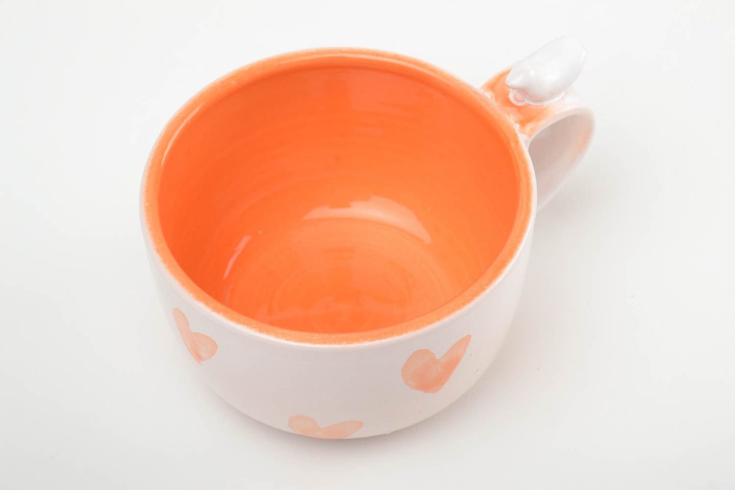 8 oz orange and white glazed ceramic teacup with a bird on handle and heart pattern photo 2