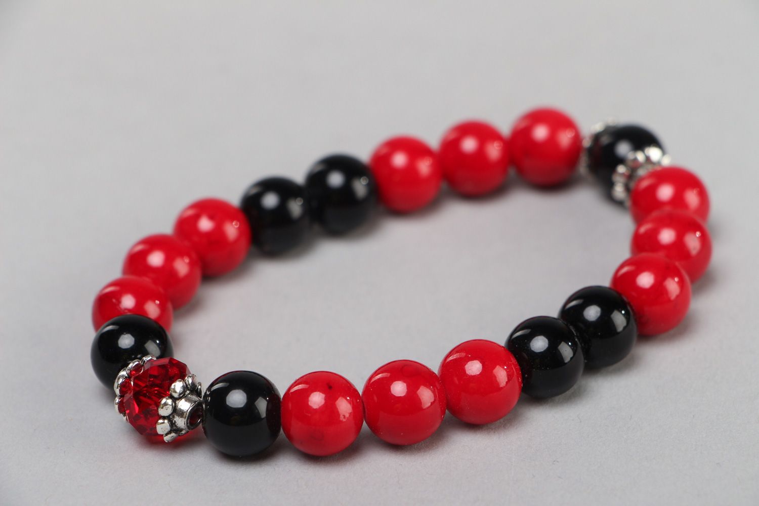 Handmade red and black stretch wrist bracelet with coral and agate stone beads  photo 4