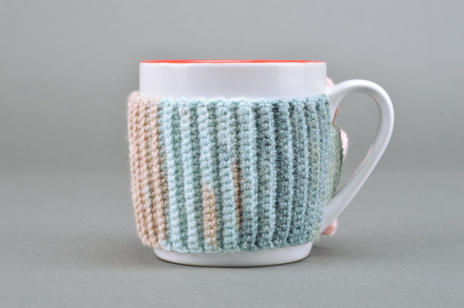 White and orange porcelain cup with crochet wool cover photo 2