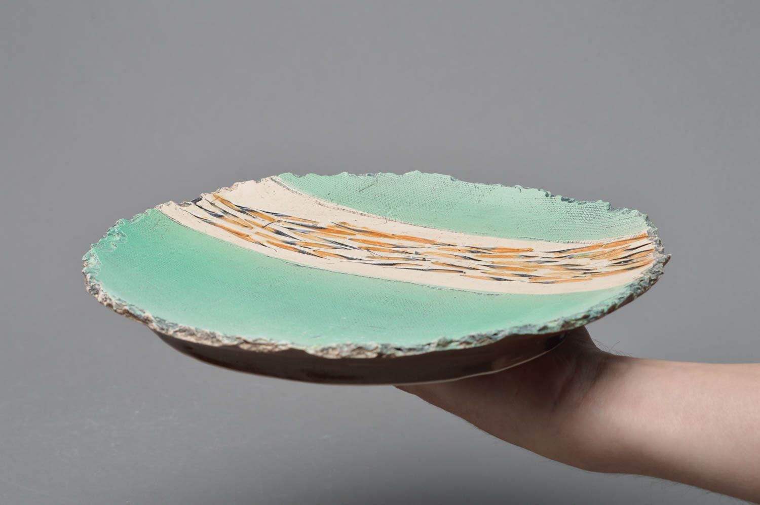 Handmade designer porcelain glazed plate with ragged edges of turquoise color photo 4