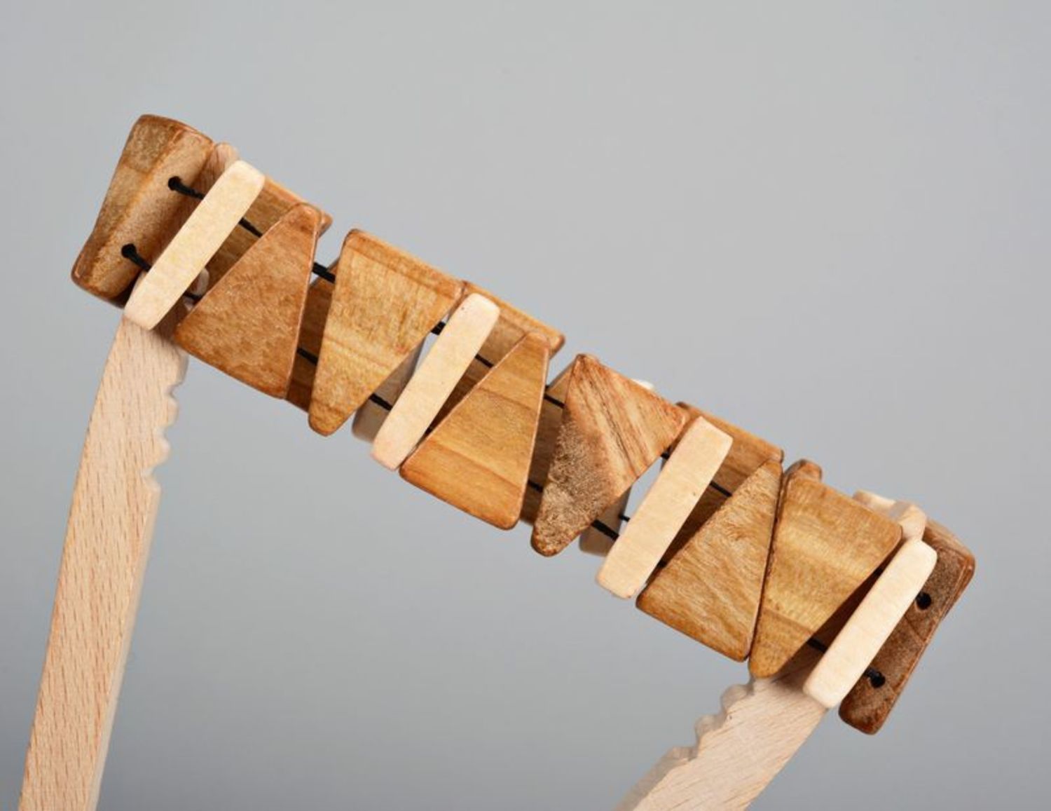 Wooden bracelet on elastic band made from triangular pieces photo 4