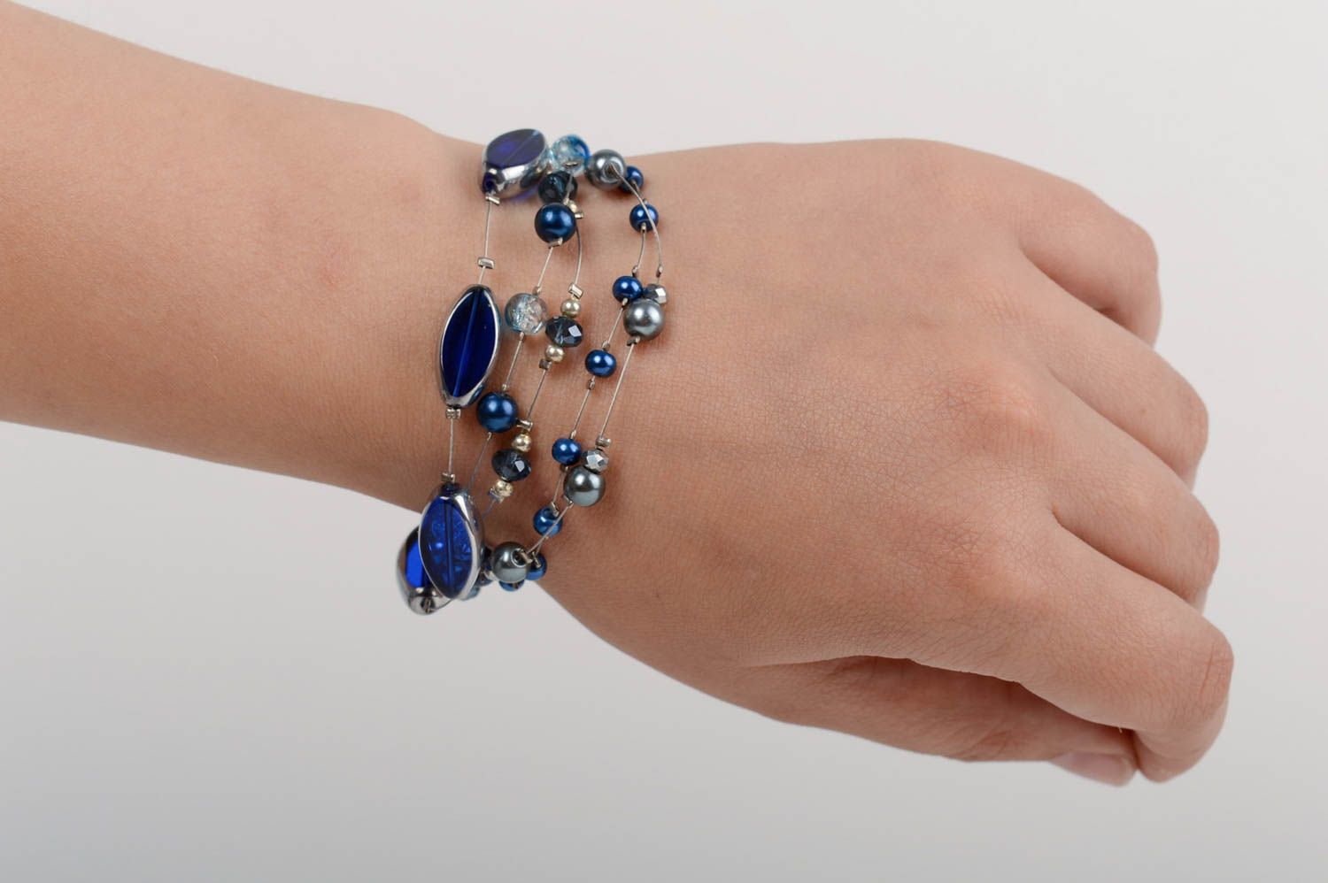 Handmade designer wrist bracelet with dark blue ceramic pearls and crystal beads photo 5