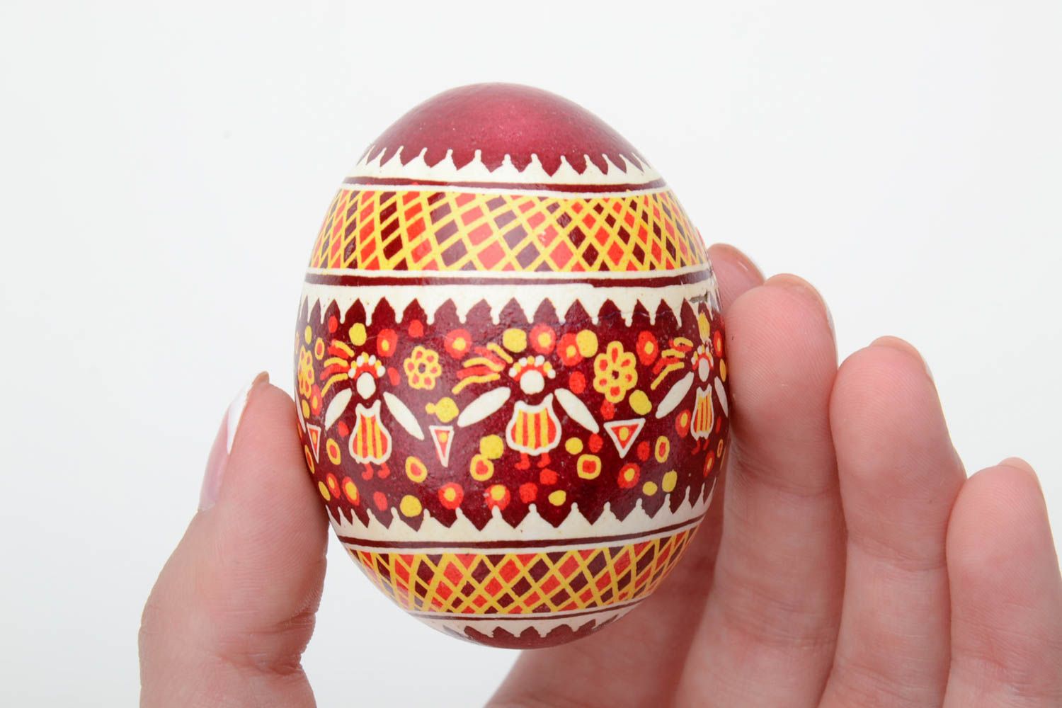 Red and yellow handmade designer painted Easter egg created using waxing technique photo 5