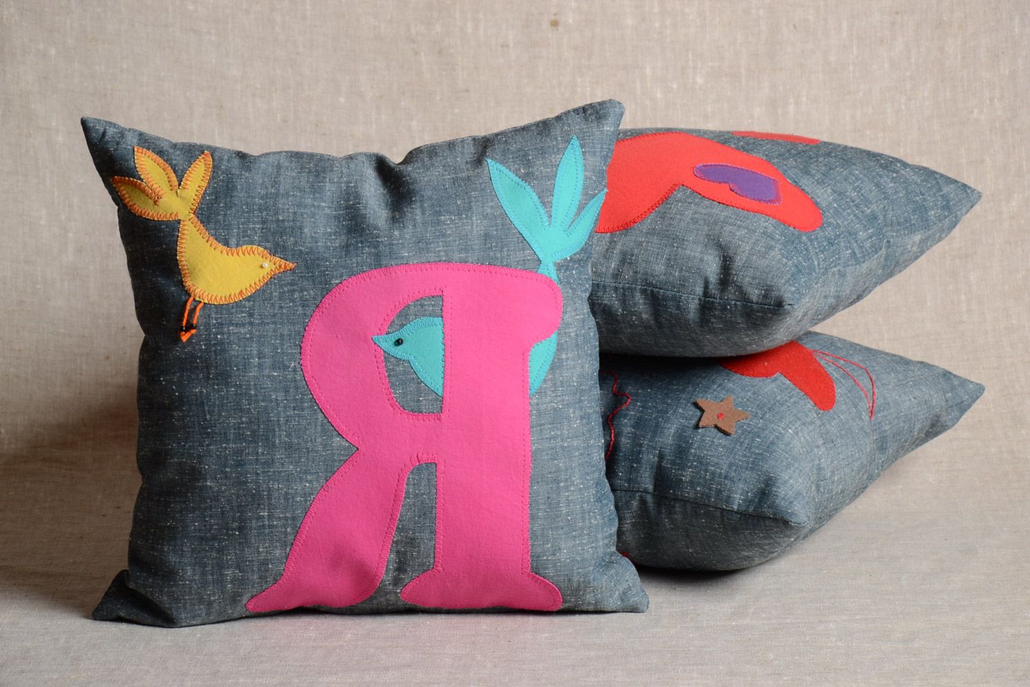 Handmade designer fabric cushion with removable pillowcase decorated with letter applique photo 1