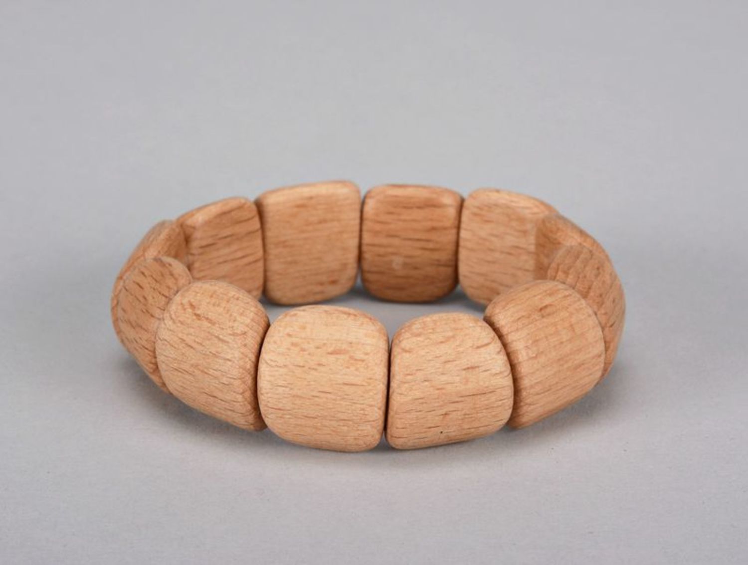 Light wooden bracelet on elastic band photo 4