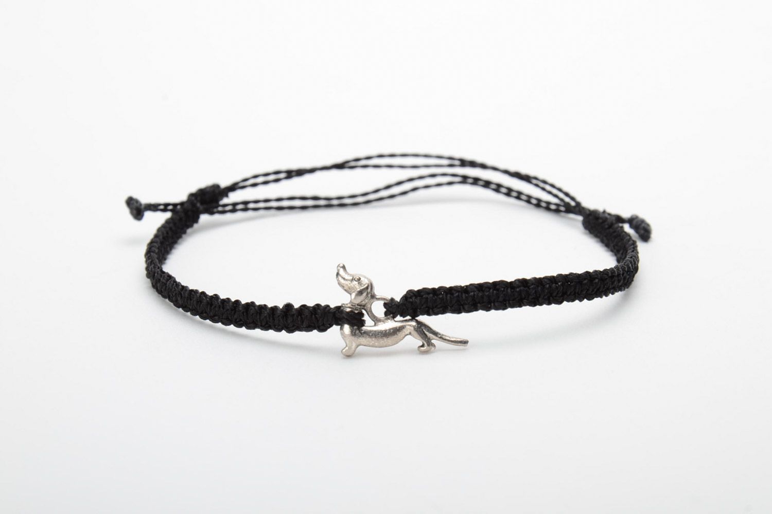 Handmade friendship bracelet woven of gray threads with a badger-dog charm photo 5