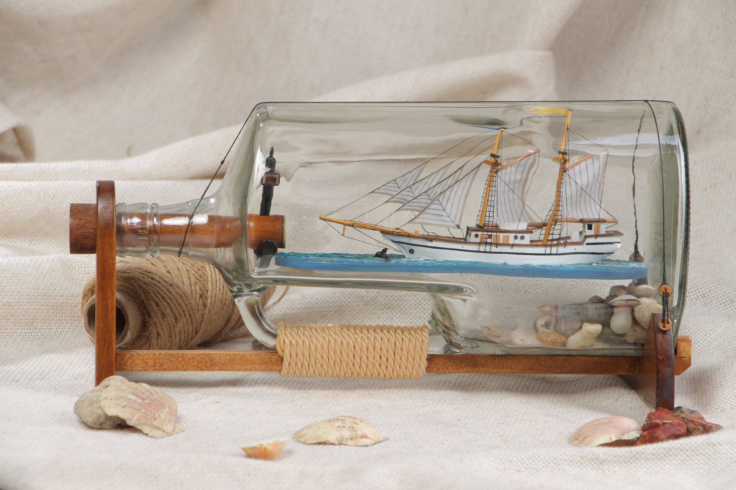 Handmade beautiful composition the ship in a glass bottle in marine style photo 1