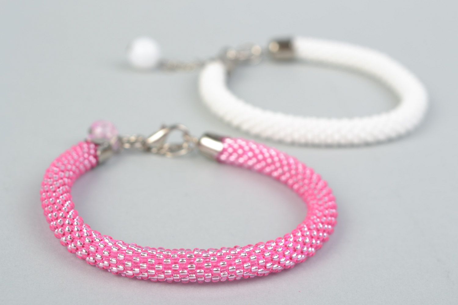 Set of 2 handmade beaded cord women's wrist bracelets in pink and white colors photo 3